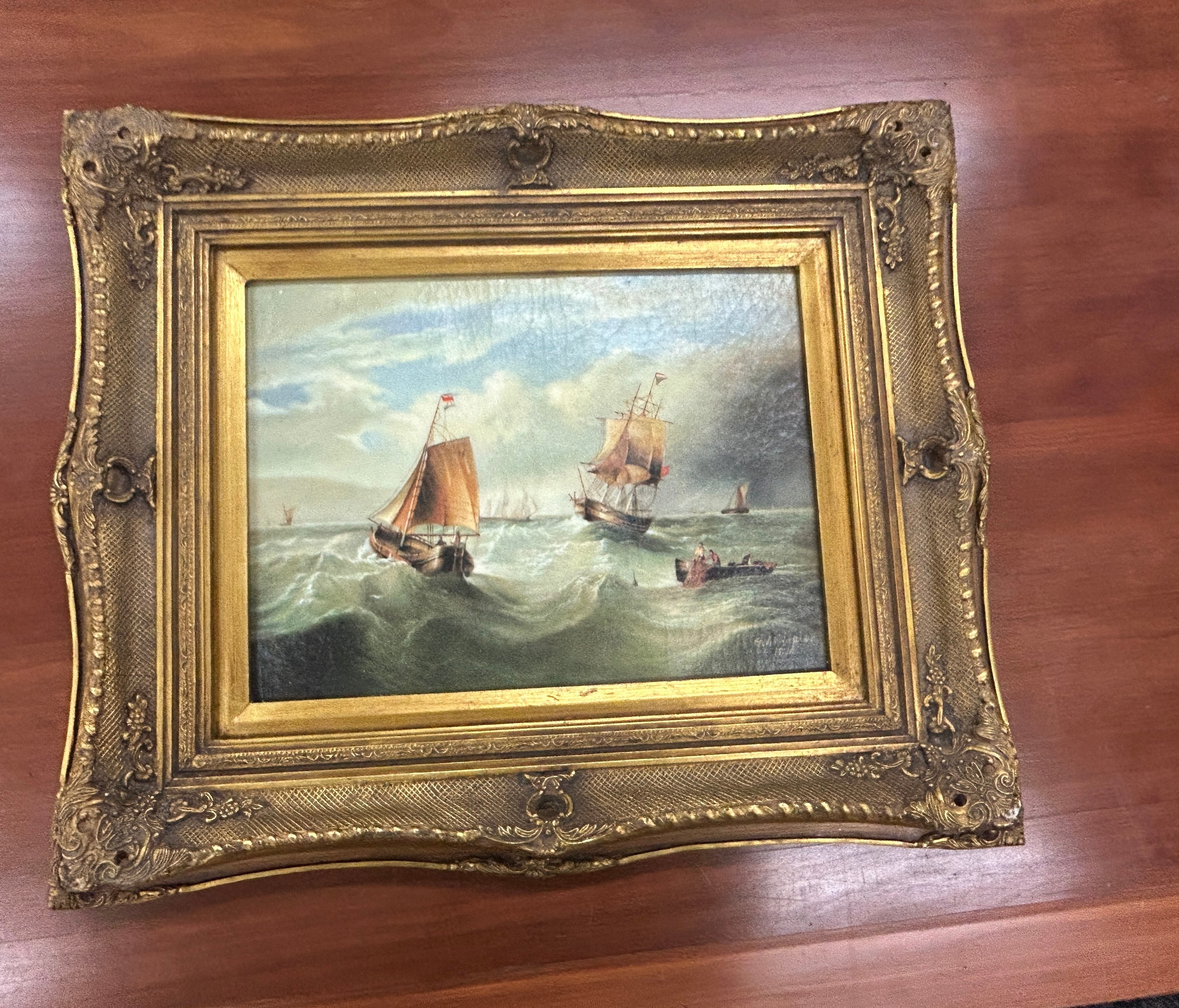 Gilt framed oil on boards depicting gallions measures approximately 24 inches tall 19 inches wide