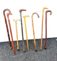 Selection of vintage wooden carved and bamboo walking sticks ( 8 in total)