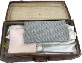 Selection of vintage linen in a vintage travel case