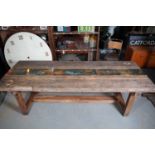 A pine workbench dining table by Parry & Sons of Shoreditch,