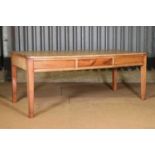 A fruitwood kitchen table,