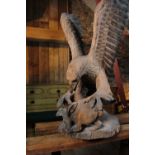 A carved pine figure of an eagle,
