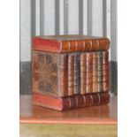 A leather faux book decanter case,