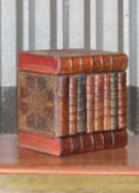 A leather faux book decanter case,