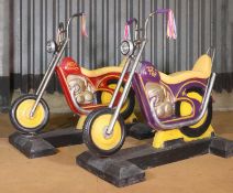A pair of fairground motorcycles,