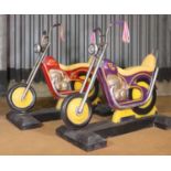 A pair of fairground motorcycles,