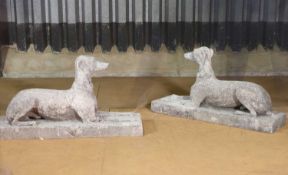 A pair of Victorian composition stone whippets attributed to Austin & Seeley,