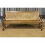 A satin-birch and bent-ply bench from the Glasgow High Court,