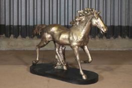 A cast iron figure of a horse,