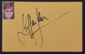 Elton John: autograph on yellow paper,