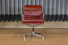 A chrome and leather desk chair after Charles and Ray Eames,