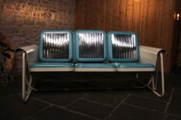 A painted-metal and chrome porch glider,