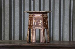 An Egyptian Revival inlaid wine table,