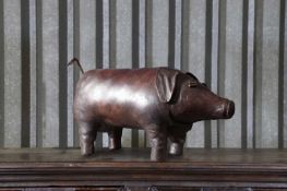 A leather pig footstool in the manner of Dimitri Omersa for Liberty