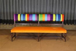 An upholstered provincial beech bench,