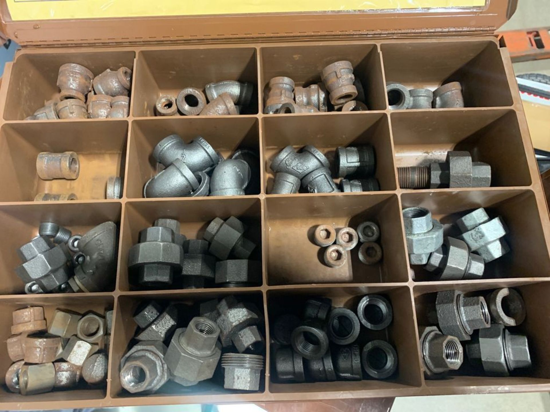 LAWSON PRODUCTS IRON PIPE FITTINGS / ENTIRE CONTENTS OF CASE INCLUDED LOT 23