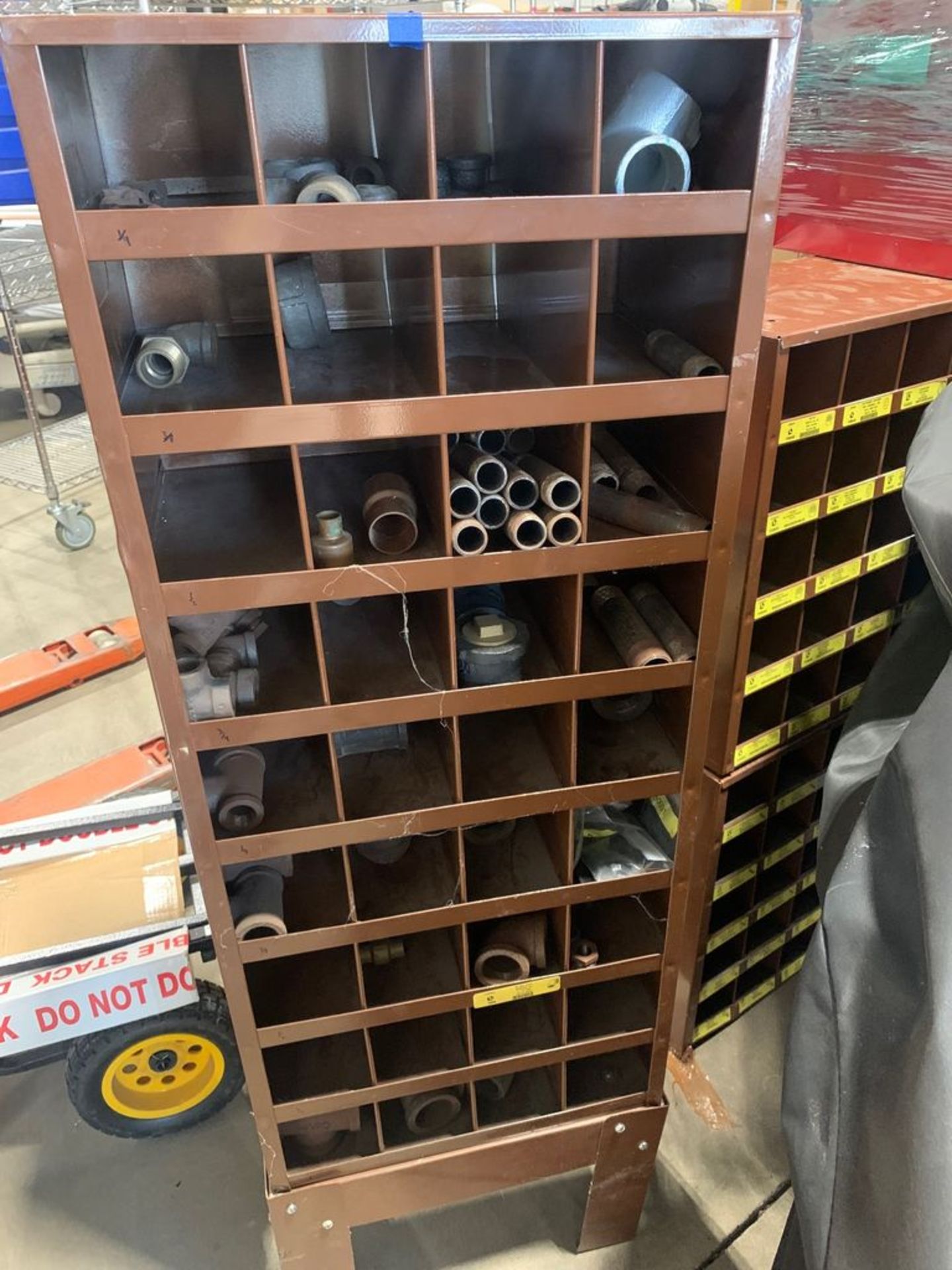 LAWSON PRODUCTS ENTIRE LAWSON RACK INCLUDING ALL PIPE FITTINGS. LOT 25