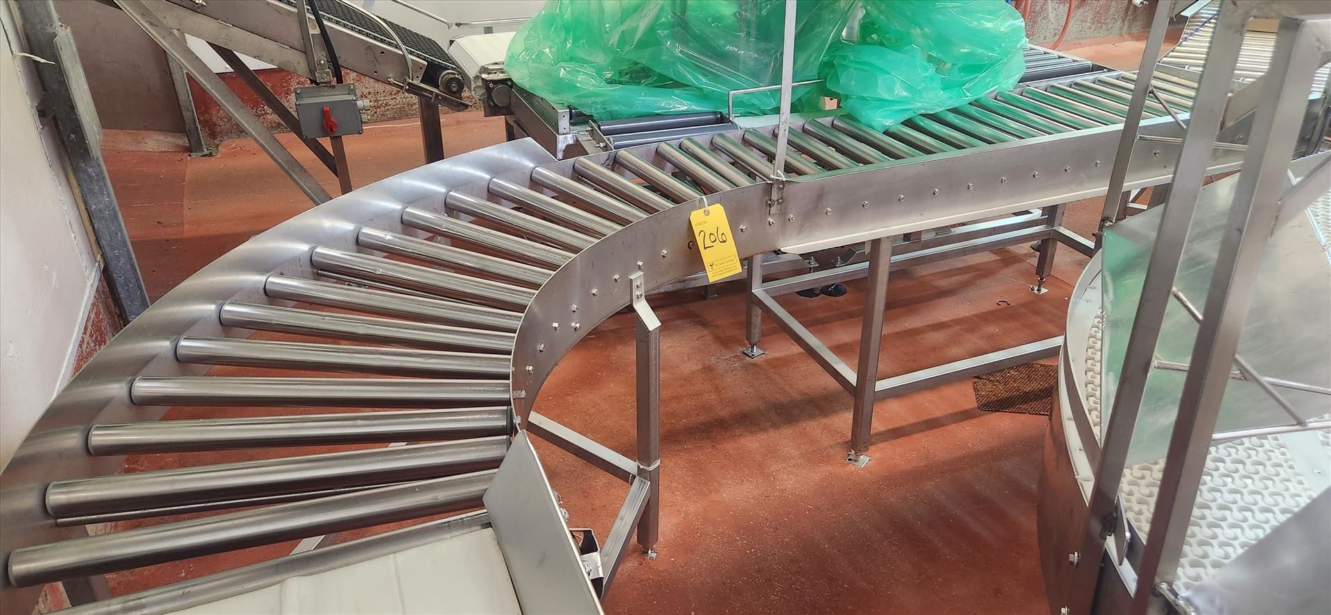 conveyor, roller, stainless steel frame, 45 deg. turn, approx. 12 in. x 24 ft. [Loc. Cut-Up]