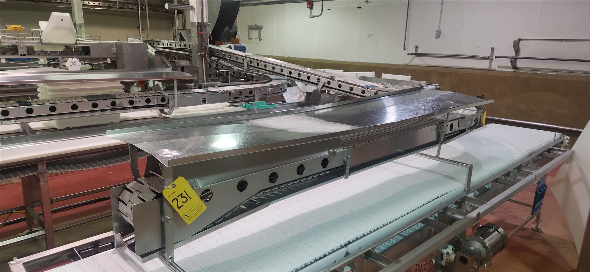 conveyor, belt, stainless steel frame, 90 deg. turn, power, approx. 7.5 in. x 32 ft. [Loc.