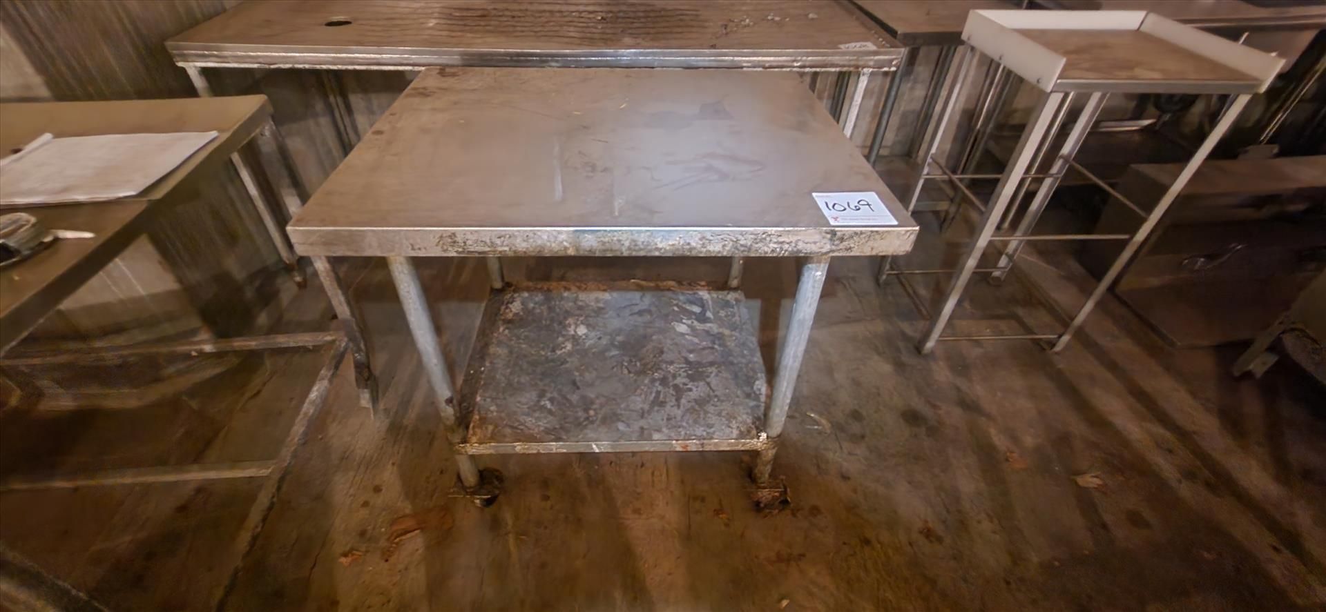 table, stainless steel top, approx. 30 in. x 36 in. [TAG 1069 - LOC Paletta Cr.]