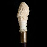 Rare cane with carved bone handle depicting a Bacchanal scene, 19th century