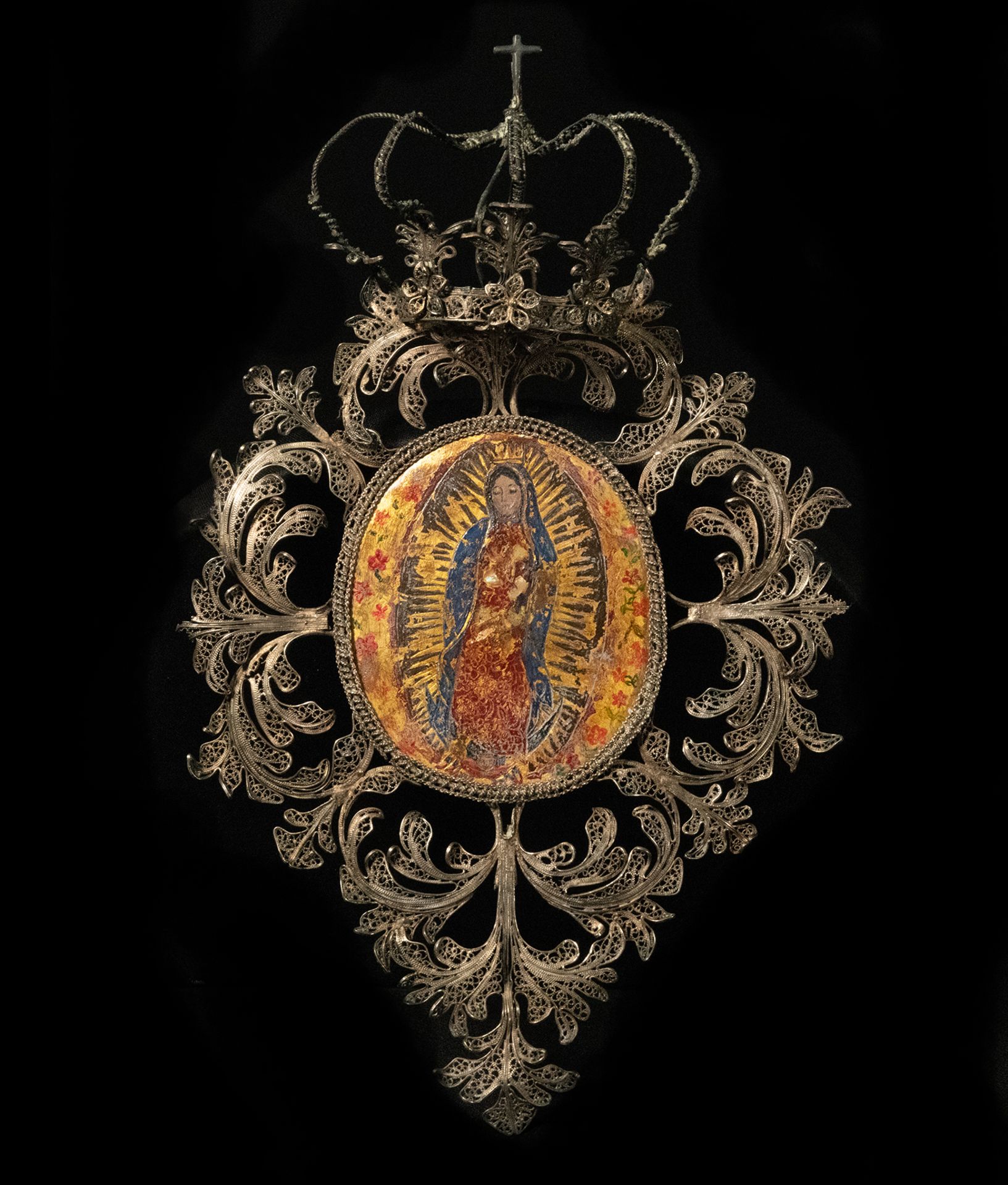 Virgin of Guadalupe in oval on board with mother-of-pearl inlays, new Spanish colonial 18th century