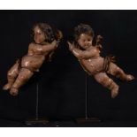 Pair of elegant Angels mounted on steel bases, possibly Mexican Colonial work inspired by models by