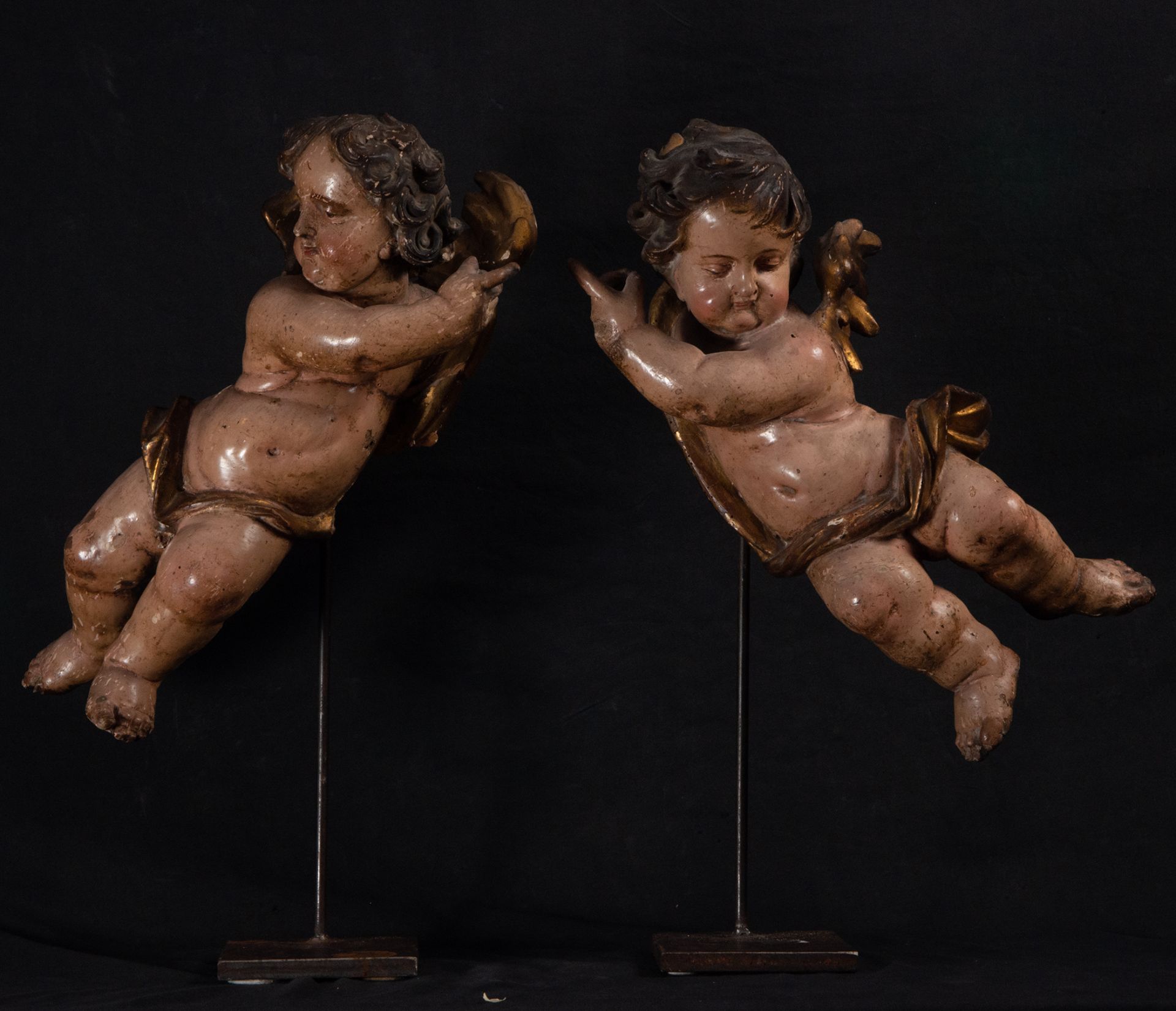 Pair of elegant Angels mounted on steel bases, possibly Mexican Colonial work inspired by models by 