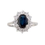 Ring with important 8 x 6 mm central sapphire and 12 modern cut diamonds of 1.10 ct