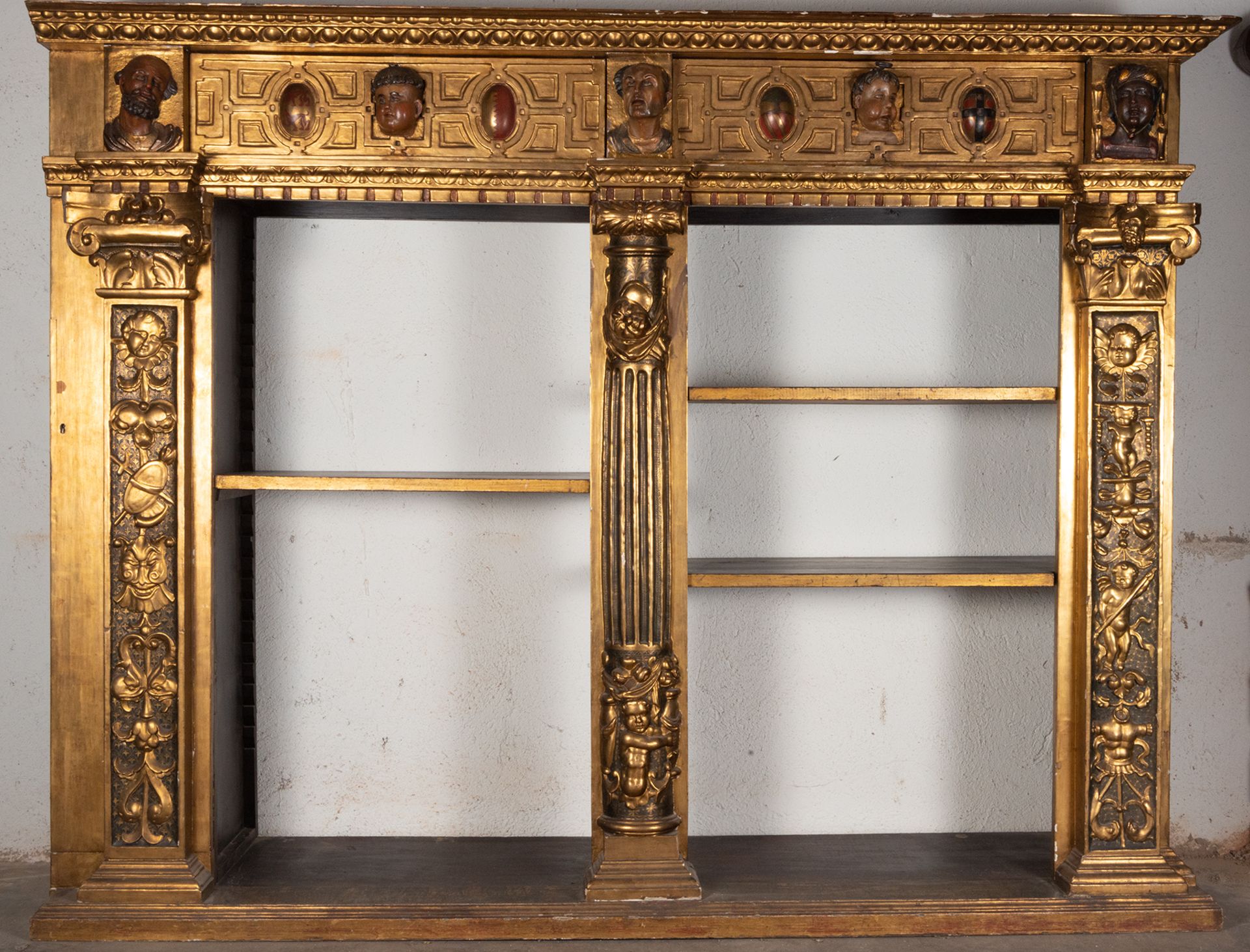 Large Bookcase Furniture made up of a Renaissance Altarpiece with shelves, 16th century, the shelves