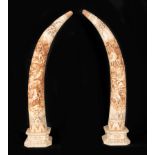 Pair of Chinese Tusks in carved bone, early 20th century Chinese school