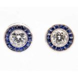 Elegant 1920s earrings with two 0.50 ct Diamonds each edged with sapphires, very good purity and col