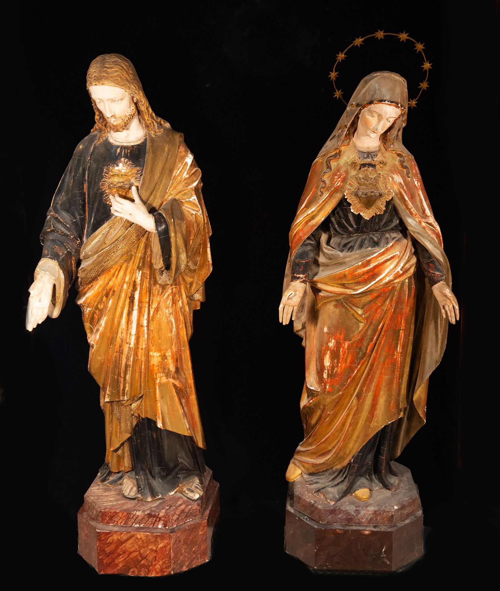 Pair of large life-size wood carvings of the Sacred Hearts of Jesus and Mary, 19th century