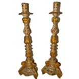Pair of Mexican colonial Torcheres in marbled and gilded wood, 18th century