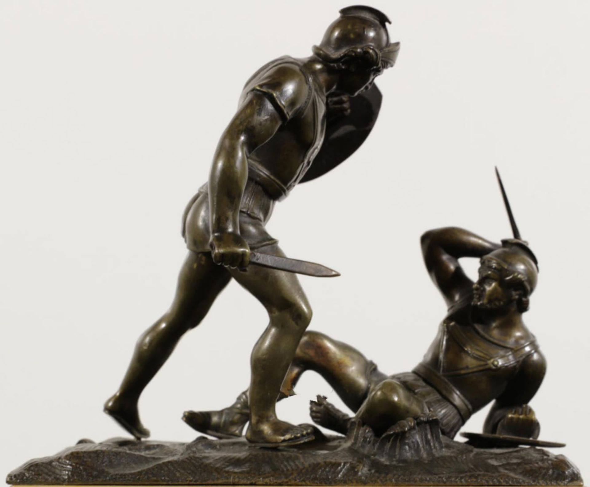 Pair of Neoclassical style Gladiators in bronze and marble, italian work of the 19th century