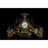 Very large Regency style Table Clock with garrison of Guardian Angels, in gilt and blued bronze, 19t