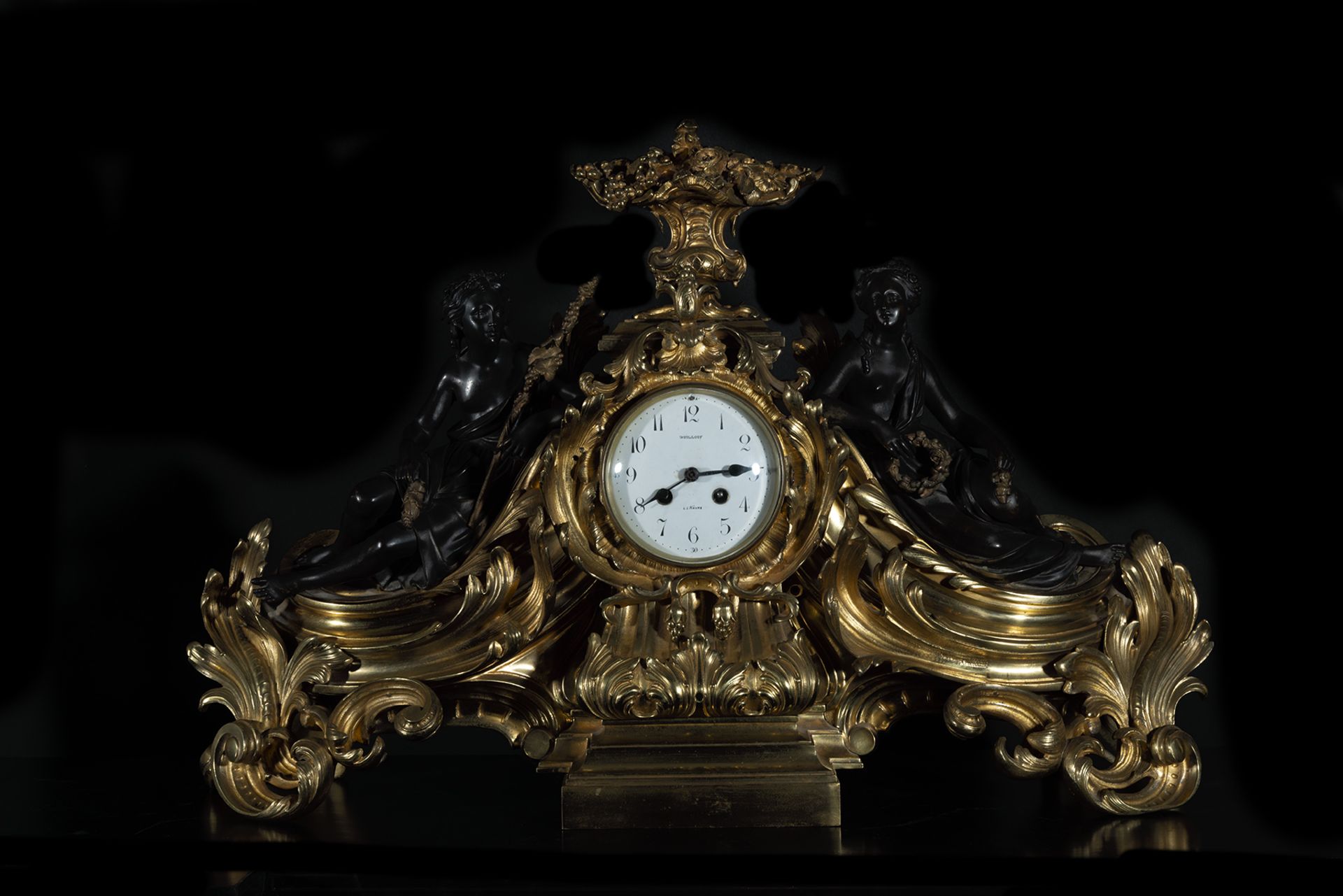 Very large Regency style Table Clock with garrison of Guardian Angels, in gilt and blued bronze, 19t