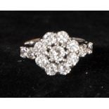 Rosette ring with central diamond and 2.60 ct total of brilliant cut diamonds, mounted in 18k white