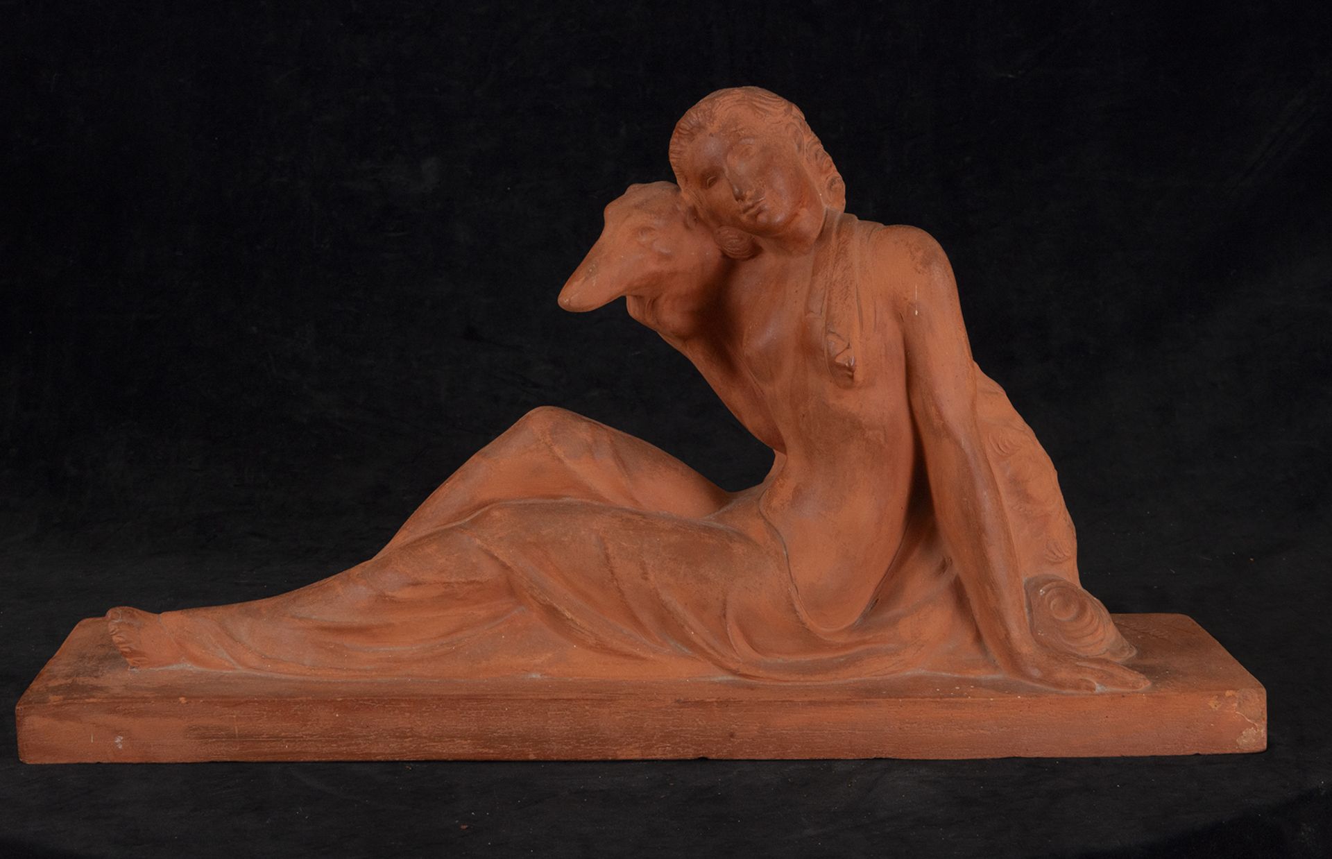 Academicist style reclining lady with dog, French school from the first half of the 20th century, si