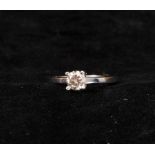 0.70 ct central diamond solitaire ring, mounted in 18k white gold