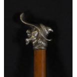 French cane, made of tropical wood and embossed silver head in the shape of a trobador's head, 19th