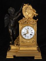 Important and elegant Louis XVI style mercury gilt bronze table clock with Cupid holding portrait of