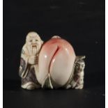 Japanese Netsuke on Mammoth Tusk (Mammuthus primigenius) representing Sage with Peach, 19th century 