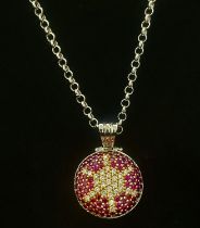 Round 18kt white gold, ruby ​​and diamond necklace.