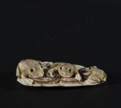 Japanese Netsuke on Mammoth Tusk (Mammuthus primigenius) representing three frogs, 19th century Japa