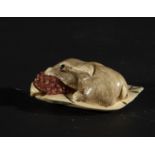 Japanese Netsuke on Mammoth Tusk (Mammuthus primigenius) depicting rabbit with fruit, 19th century J