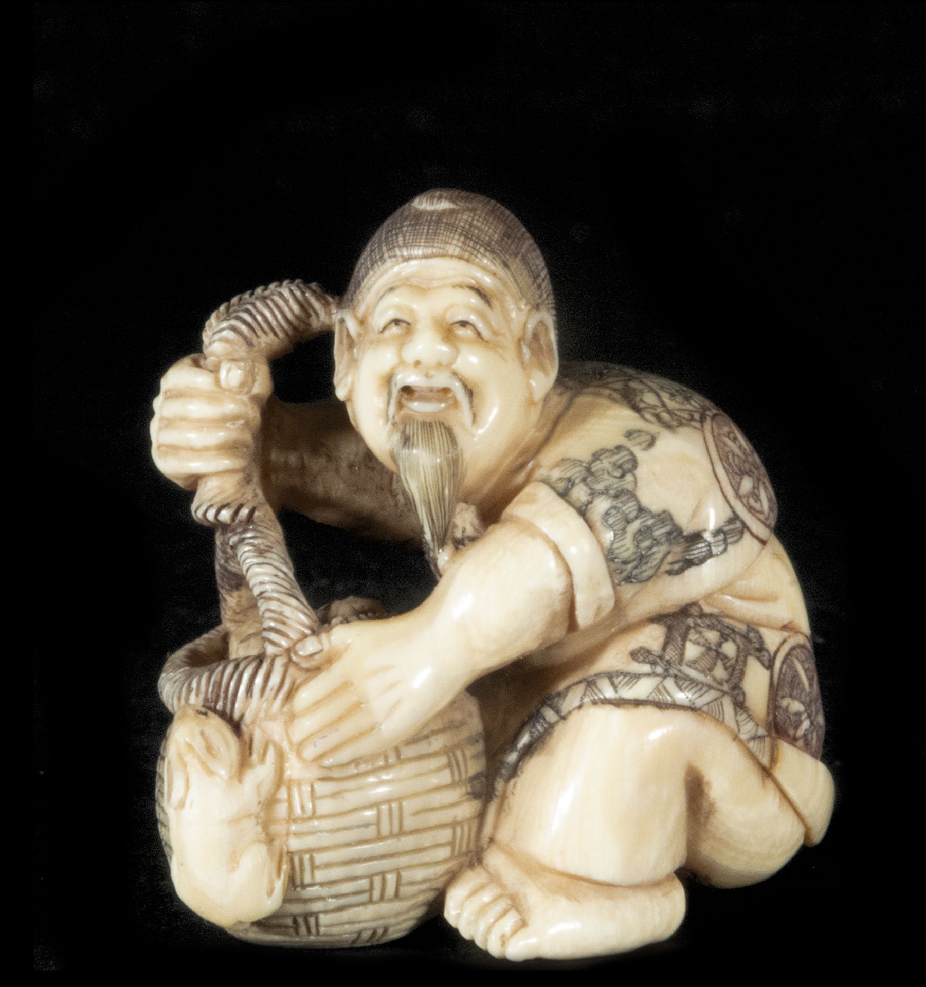 Japanese Netsuke on Mammoth Tusk (Mammuthus primigenius) depicting old man with barrel and mouse, 19