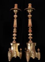 Pair of large Italian baroque torcheres in gilded wood, 18th century