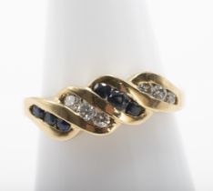 18 kt gold ring with sapphires and diamonds