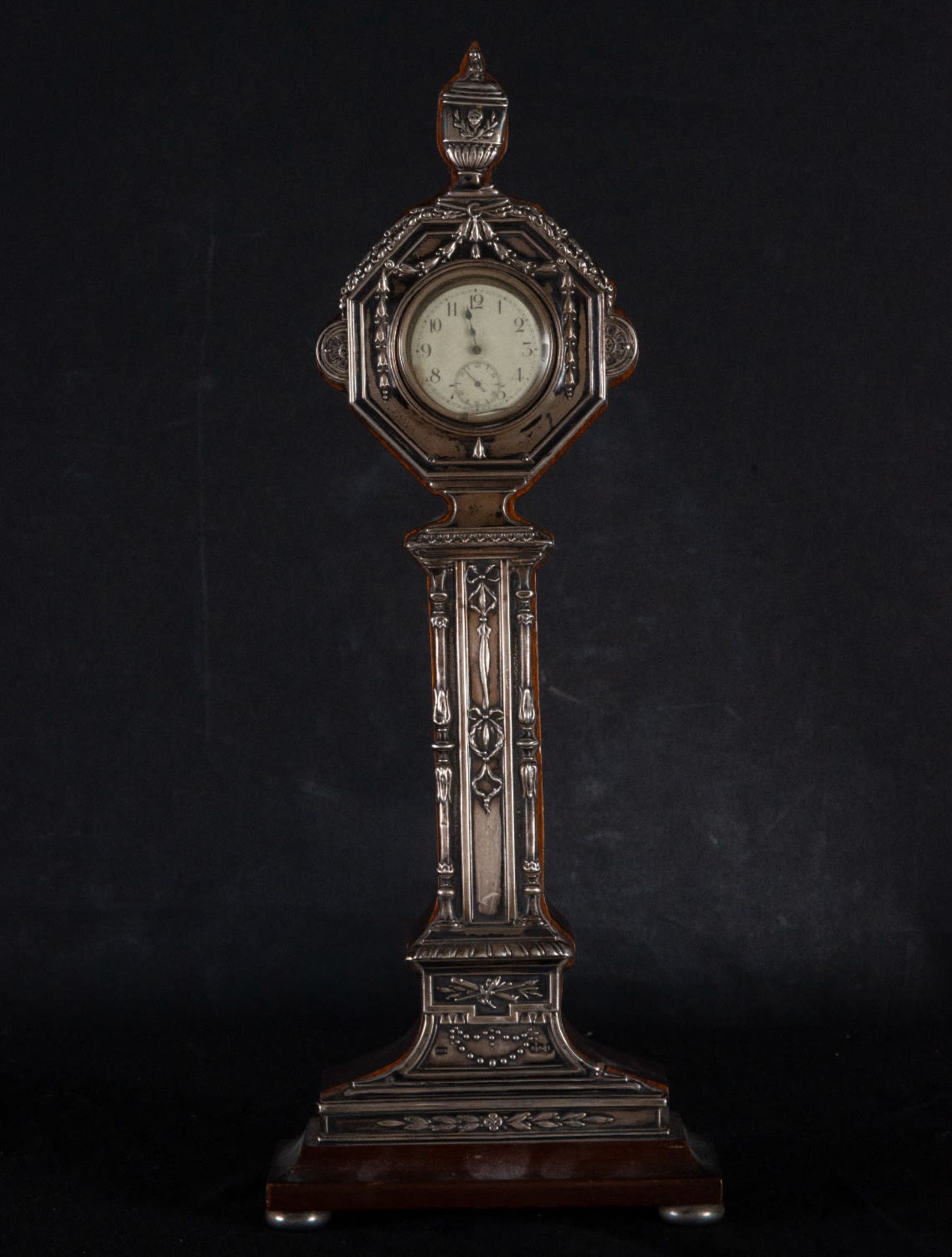 Mahogany clock covered with embossed silver, 19th century